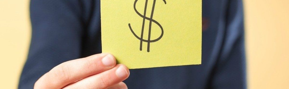 man holding post-it with dollar sign image