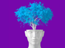 A white bust sits before a purple background as a blue tree grows from the head. representing the future of ERP