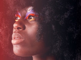 Black woman looking toward the sky, representing lack of diversity and inclusion in the media and entertainment industry.